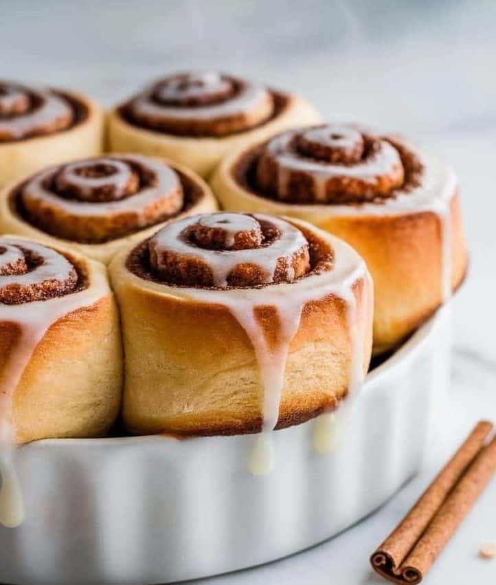 A pan of steaming, freshly baked cinnamon rolls